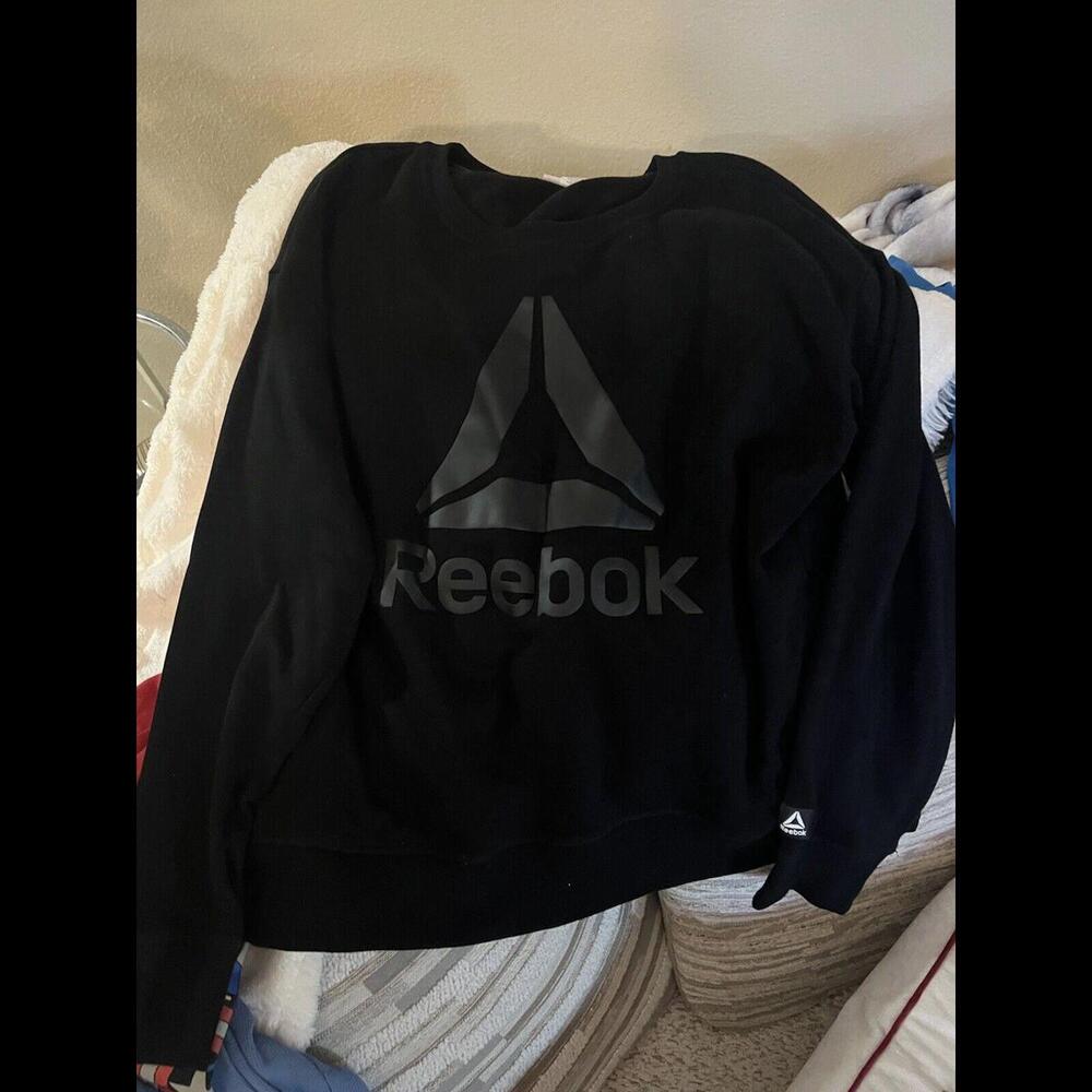 Reebok woman a large Black  pullover jacket